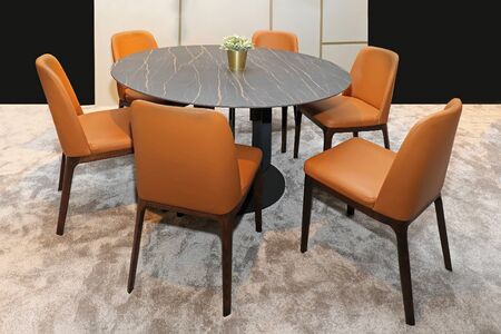 Modern dining room table interior with orange leather chairs furnitureの写真素材