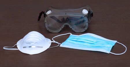 Protective equipment face masks and eye glasses used by medical workers for virus protectionの写真素材