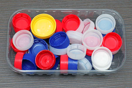 Colorful plastic bottle caps pile from waters and sodasの写真素材