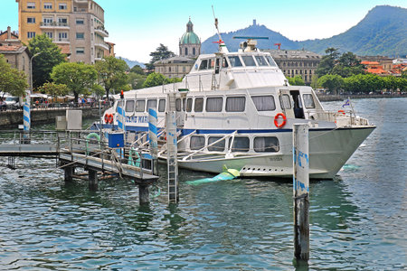 Lake Garda, Italy - June 15, 2019: Tourists waiting to board local retro cruise ship for crossing the lake in Italyのeditorial素材