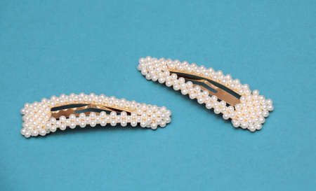 Fashionable retro gold hair pins with white pearlsの写真素材