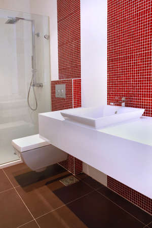 Small contemporary guest bathroom with red tilesの写真素材