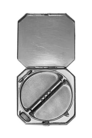 Retro open empty silver metal powder boxの写真素材