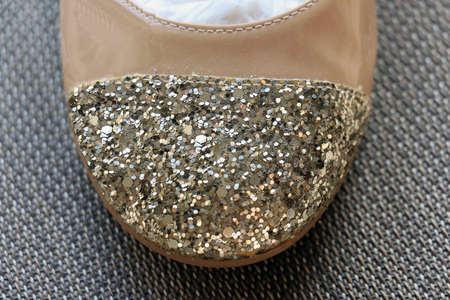 Modern sparkling leather shoe with gold glitter toesの写真素材