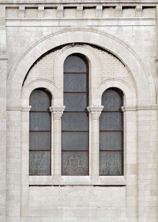 Ancient glass window exterior with marble wall facadeの写真素材