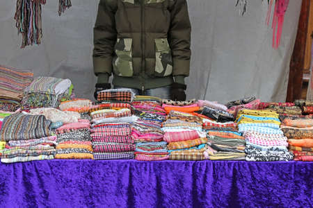 Colorful fashion scarves accessories on London street market stallの写真素材