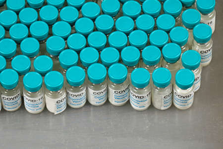 Covid-19 vaccine vials production manufacturing in pharma industry on laboratory shelfの写真素材