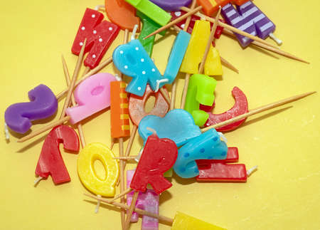 Decorative colorful wax candles pile used for party celebrationsの写真素材