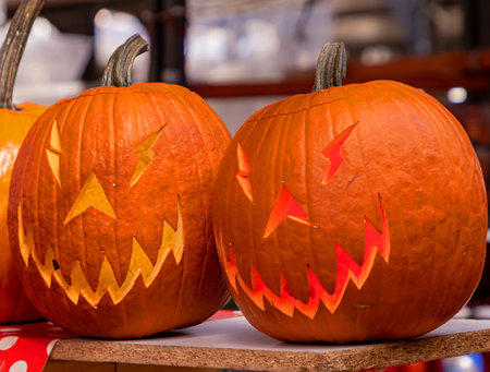 Decorated pumpkins with scary mouth and eyes ready for Halloween holidayの写真素材