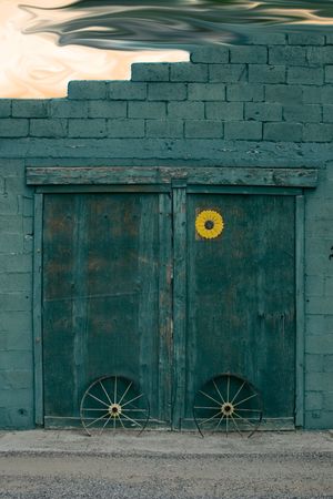 barn doors with green flamesの写真素材