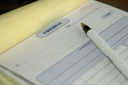 receipt book with penの写真素材