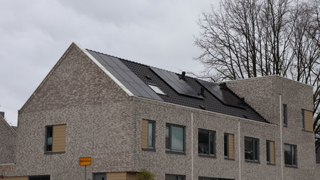 House with solar panels on the roof of a building in the Netherlandsの写真素材