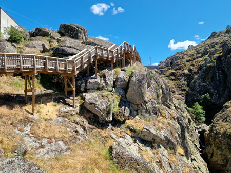 Wooden bridge over a mountain river, tourist attractionの写真素材