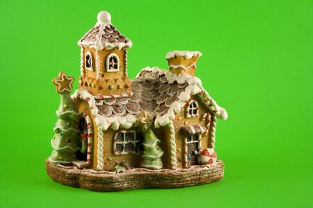 Gingerbread House on Green Backgroundの写真素材