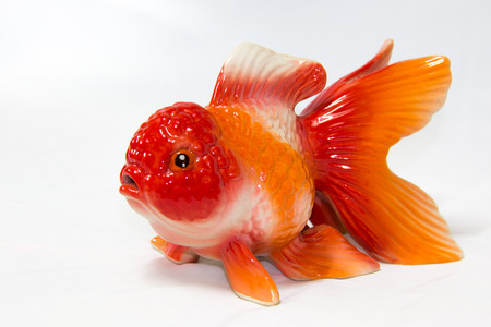 Ceramic goldfish in isolated on white background.の写真素材