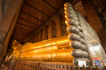 Golden Buddha statue in a temple, thailandのeditorial素材