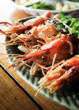 Grilled shrimp with green lettuce that looks delicious.の写真素材