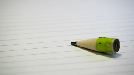 Short pencil on note book background.の写真素材