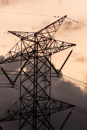 High voltage pole in the evening with sky background.