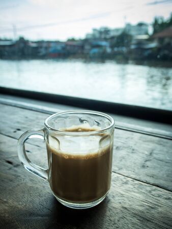 Cup of coffee on the wooden tableの写真素材