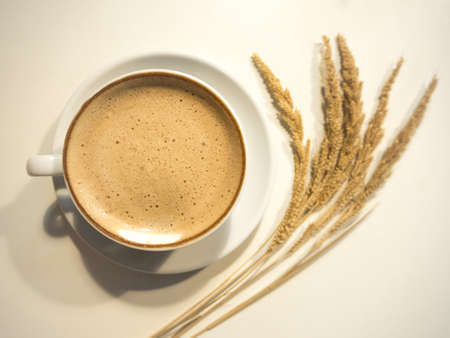 Hot coffee in the ceramic cup on the table.の写真素材