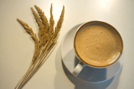 Hot coffee in the ceramic cup on the table.の写真素材