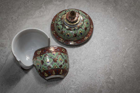 The benjarong porcelain was damaged on the granite floor.の写真素材