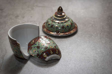 The benjarong porcelain was damaged on the granite floor.の写真素材