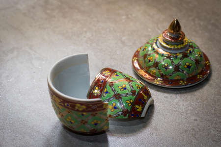 The benjarong porcelain was damaged on the granite floor.の写真素材
