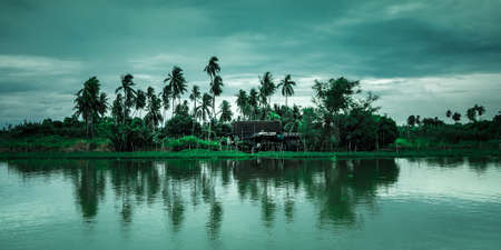 A small house on an island in the lake.の写真素材