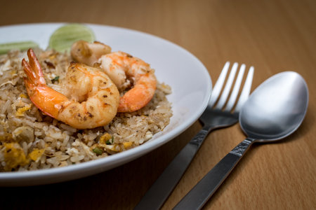 Fried rice with shrimps in a white plate.の写真素材