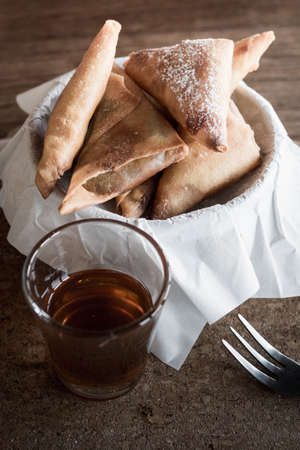 Close up of fried banana with honey syrup on the wooden table. Selective focusの写真素材