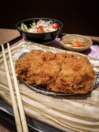 Fried chicken with rice, salad and kimchiの写真素材
