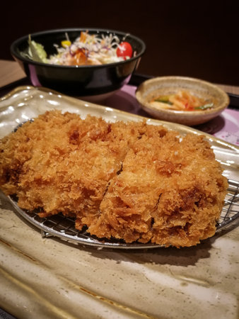 Fried chicken with rice, salad and kimchiの写真素材