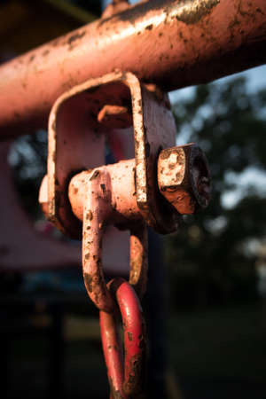 rusty chain fixed by nut with boltの写真素材