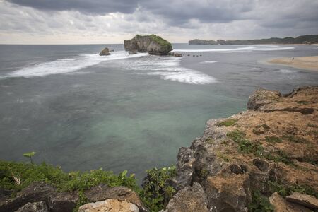 Scenic view of Ngandong Beach, Gunungkidul, Yogyakartaの写真素材