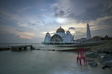 Malacca Straits Mosque in sunset - Masjid Selat Melaka. It is a mosque located on the man-made Malacca Island near Malacca Town. Malaysiaのeditorial素材