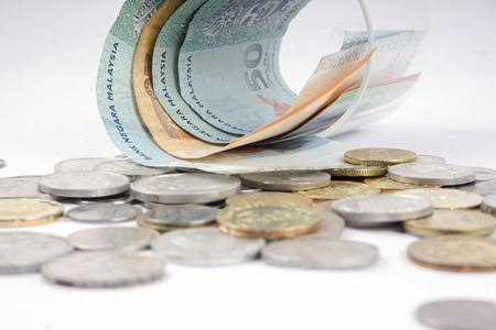 Coins and notes on table. Saving and business concept.