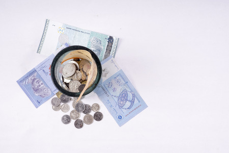Coins and notes on table. Saving and business concept.の写真素材