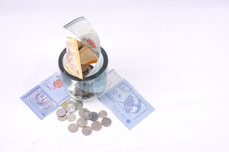 Coins and notes on table. Saving and business concept.