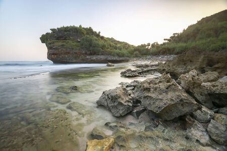 Amazing view of Yogyakarta seascape with natural coastal rock as foreground