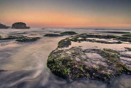 Amazing view of Yogyakarta seascape with natural coastal rock as foregroundの写真素材