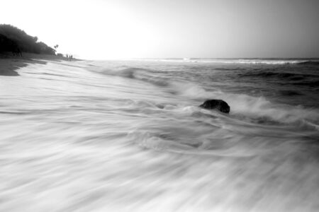 Amazing view of Yogyakarta seascape with natural coastal rock as foregroundの写真素材