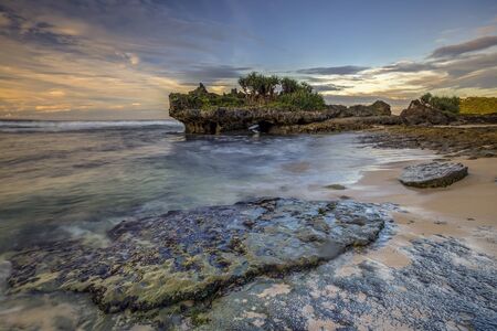 Amazing view of Yogyakarta seascape with natural coastal rock as foregroundの写真素材