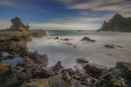 Amazing view of Yogyakarta seascape with natural coastal rock as foreground