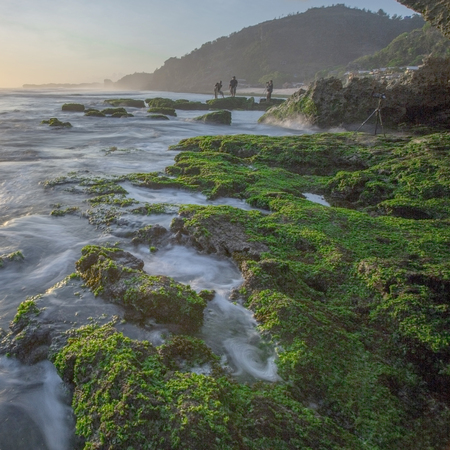Amazing view of Yogyakarta seascape with natural coastal rock as foreground