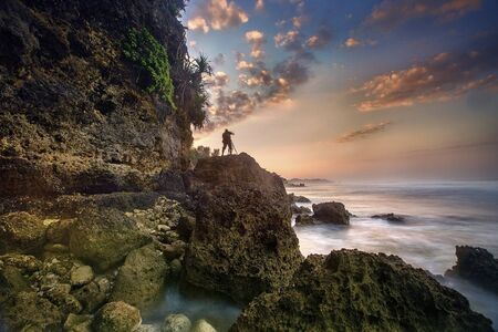 Amazing view of Yogyakarta seascape with natural coastal rock as foregroundの写真素材