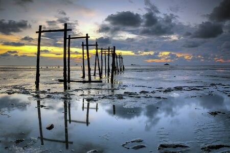 The majestic sunset captured at Pantai Jeram, Selangor, Malaysia. The motion of cloud and water is due to long exposure effect.の写真素材