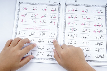 Boy reading Quran.のeditorial素材