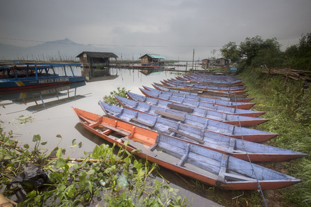 Amazing view of colorful small boats at tropical lake in Yogyakarta, Indonesiaのeditorial素材
